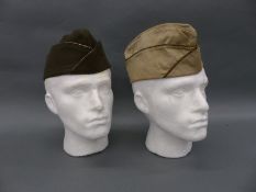 Two US military garrison caps, one marked Winkeller Joseph 11114698,