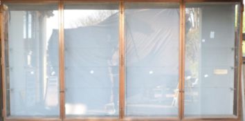 Ex Victoria & Albert Museum early 20thC four door glass display cabinet with bronzed frame.