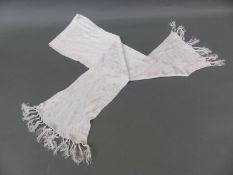 A white silk aviator's scarf,