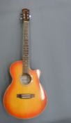 Gremlin electric/acoustic guitar model MG9712E Q C/S with flame/sunburst body and six steel strings