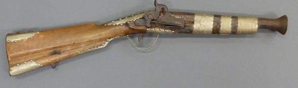 Eastern percussion hammer action blunderbuss with engraved silver banding,