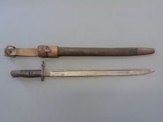 United States Army Remington 1917 pattern bayonet in leather scabbard and later bayonet frog (1940),