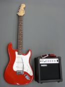 Encore electric rhythm guitar in red lacquered finish complete with an Acoustic Solutions GA-20W