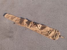 WWII Lee Enfield canvas gun slip with outer storage pocket stamped to the fastening 'MECO 1916' and