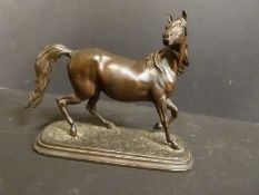 A Spelter figure of a galloping horse, 21.
