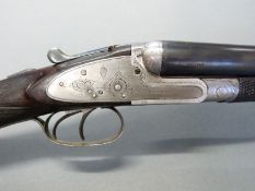 Williams & Powell 12 bore side lock shotgun with named and engraved locks,