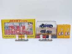 Four Atlas Editions Dinky Toys diecast model vehicles and accessories comprising Two Esso Petrol