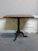 A19thC mahogany tilt top table with cross banded decoration to top, raised on tripod base,