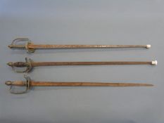Three swords, one after French Gendarmes c1850 / 1871 with indistinct coat of arms,