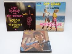 A collection of Cliff Richard albums,