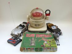 A collection of various toys including Tomy Omini Junior robot, remote controlled car,