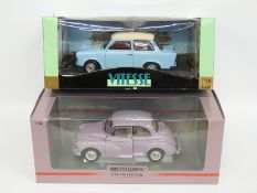 Two 1:18 scale diecast model cars Minichamps Morris Minor Million limited edition and Vitesse Trabi,