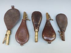 Five leather and brass shot flasks, one with embossed scenes of birds to both sides,