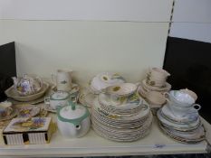 A quantity of retro tea and dinnerware including Midwinter Stylecraft and crinoline lady decorated
