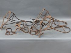 Three saddle racks and four bridle racks,