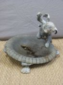 A 19thC lead bird bath with cherub, raised on lion paw feet,