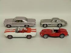 Four Danbury and Franklin Mint diecast model cars comprising Mercedes-Benz 300SL, 1965 Pontiac GTO,