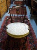A late 19thC tub or saloon chair with inlaid decoration