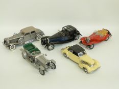 Five Franklin Mint diecast model cars comprising 1935 Mercedes-Benz 500K Special Roadster,