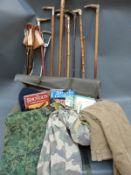 A collection of horn mounted sticks, spade, shooting seats, books on shooting,