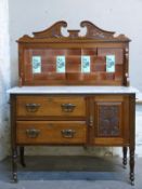 A late 19th/early20thC marble topped tile back washstand with two drawers and cupboard to base,