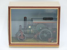 A scratch built model steam roller in wood and perspex display case,