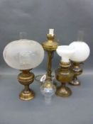 Four brass oil lamps