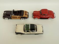 Three Danbury Mint diecast model cars comprising 1948 Chrysler Town & Country,