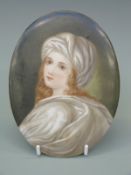 An oval porcelain plaque decorated with a girl, possibly KPM/Berlin, 17cm tall,