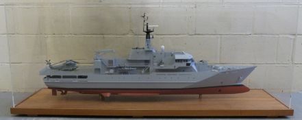 A large scale model of HMS Clyde in perspex display case,