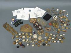 A collection of military metal and cloth badges, buttons, two identity tags for H D Smith 14316927,