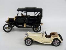 Two Franklin Mint diecast model cars The 1913 Ford Model T and 1938 Jaguar SS 100,