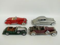 Four Danbury and Franklin Mint diecast model vehicles comprising 1930 Dusenburg J Derham Tourer,