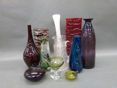 A collection of coloured glassware including Whitefriars,