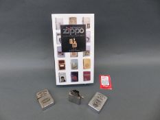 Two Zippo Vietnam war lighters and a book about collecting Zippos