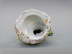 An 18thC figure of a man with dog,