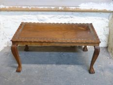 A carved Eastern coffee table,