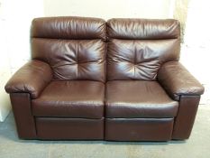A leather two seater sofa with electric reclining facility