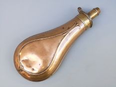 G & J W Hawksley copper and brass powder flask with embossed scrolling decoration,