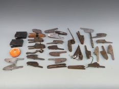A large collection of various gun parts including lock plates,