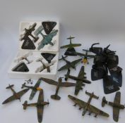 Twelve Atlas Editions diecast model military aeroplanes on named stands,