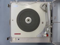 A c1950s Phillips 'Diamond' stereo portable record player with speakers incorporated in the lid,
