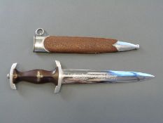 A Nazi German SA dagger marked RZM M7/49 to the 22cm blade in covered metal scabbard