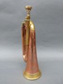 A military brass and copper bugle manufactured by Besson,