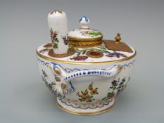 A French porcelain inkwell / standish with ormolu mounts and insect decoration, complete with seal,
