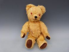 Two vintage golden mohair teddy bears both with cocked wrists and 90° feet,