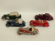 Five Danbury Mint diecast model cars comprising 1932 Cadillac V-16, 1934 Packard V-12,