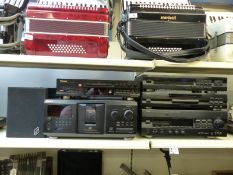 A stack hi-fi system comprising Yamaha CD player,