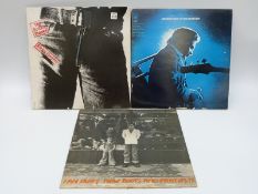 A case of mixed albums including The Beatles Sgt Pepper and Abbey Road,