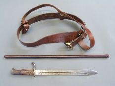 WWI leather 'Sam Brown' belt and swagger stick and a Simson and Co Suhl German bayonet,